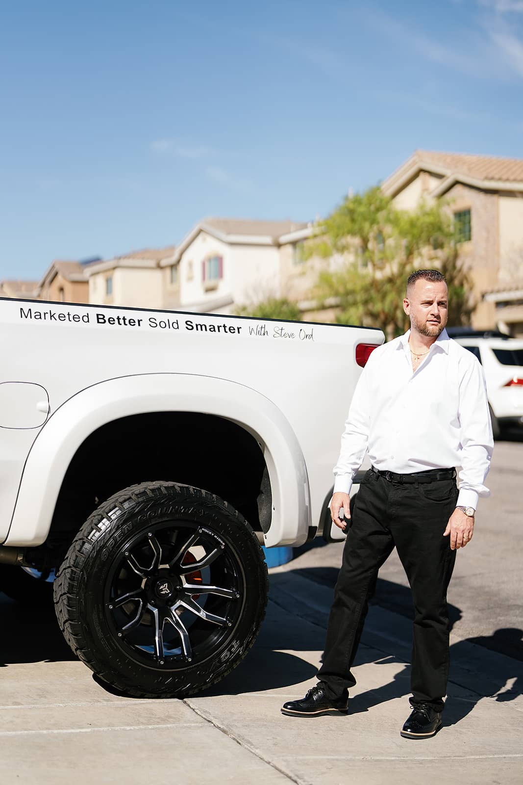 Steve Ord standing infront of his branded truck